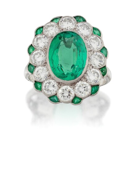 A platinum, emerald and diamond cluster ring, the central millegrain-set oval mixed-cut emerald with old-brilliant-cut diamond surround and emerald accents, to a pierced gallery, approx. ring size N A verbal opinion from the Gemmological...