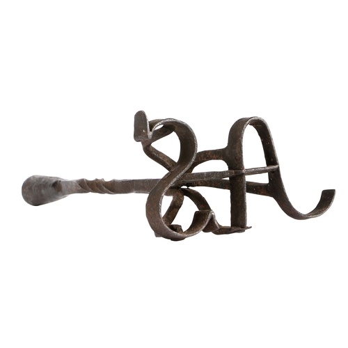 A rare and unusual wrought iron branding socket candlestic...