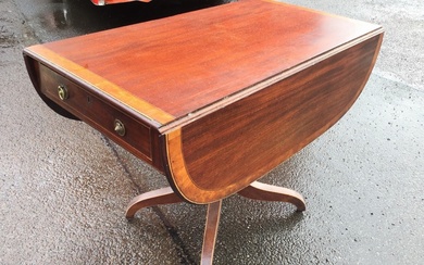 A regency mahogany pembroke table with rounded rectangular satinwood crossbanded...