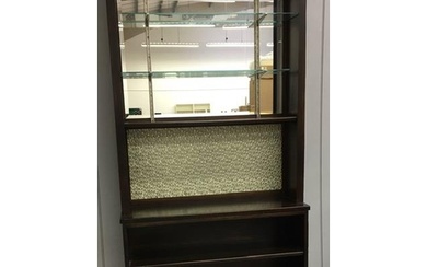 A retro upright drinks cabinet, with glazed shelf area over ...