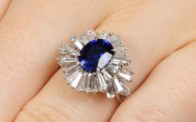 A sapphire and tapered baguette-cut diamond dress ring.