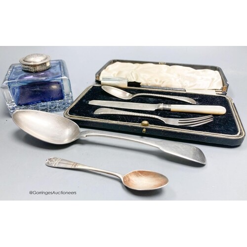 A silver mounted glass inkwell, two silver spoons and a sil...