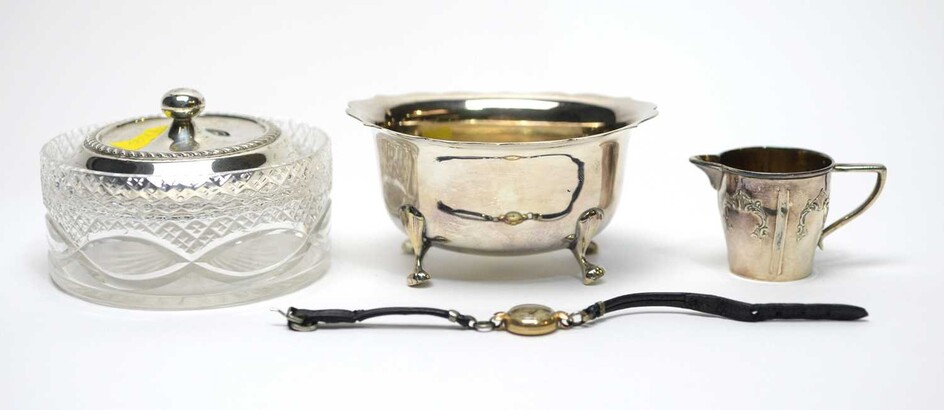 A silver-mounted powder jar, a German cream jug and a sugar basin.