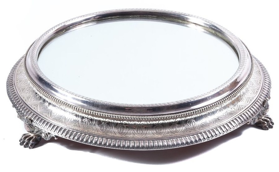 A silver-plated centerpiece on claw-legs