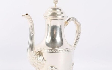 A silver pot resting on four arched feet adorned with flutes and ribbons crossed in recall on the neck and grip, the baluster body is supported by a frieze of laurel leaves, the hinged lid is surmounted by a fretel depicting a fruit.