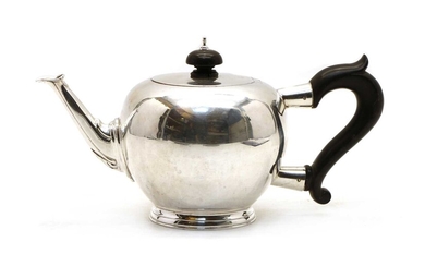 A silver teapot in the George II style