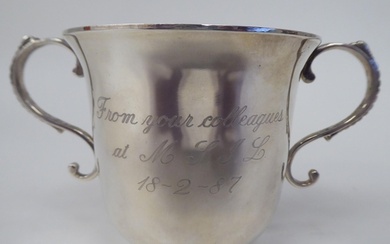 A silver twin handled, footed cup of bell design Birmi...