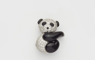 A small 18k white gold onyx and diamond panda brooch, can also be worn as a pendant.
