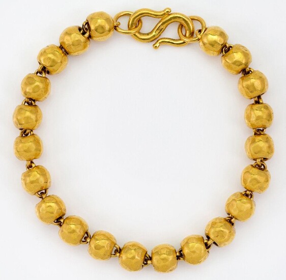 A textured bead bracelet, to an S shaped clasp, clasp stamped 9999, length 18.0 cm, approximate gross weight 37g