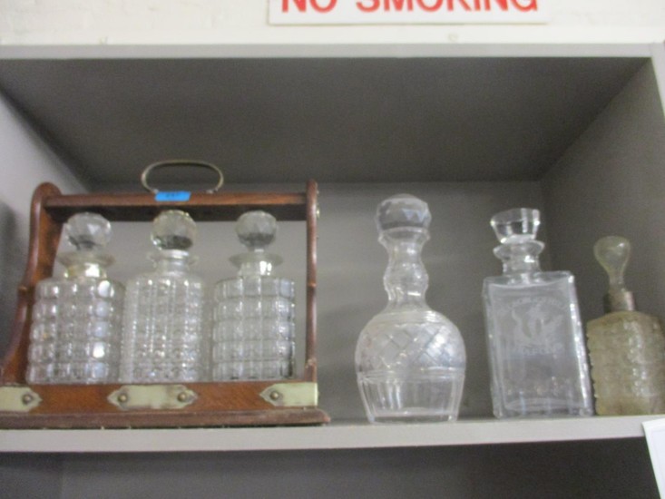 A three decanter Tantalus and mixed decanters Location:RWB