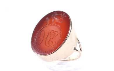 A vintage gold signet ring set with a Victorian oval carnelian intaglio. The carnelian approx, 24.