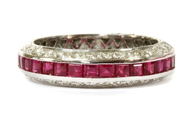 A white gold ruby and diamond half eternity ring