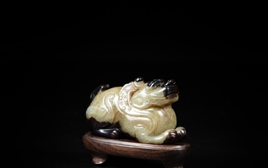 A yellow and russet jade bixie, Qing dynasty or earlier...
