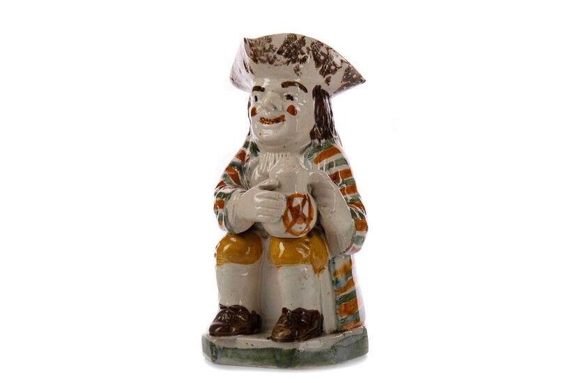 AN EARLY 19TH CENTURY TOBY JUG