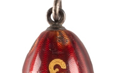 AN EGG PENDANT WITH A BULLET FROM THE WORLD WAR I