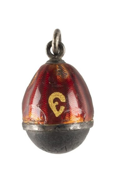 AN EGG PENDANT WITH A BULLET FROM THE WORLD WAR I