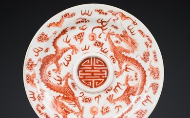 AN IRON-RED AND GILT 'DRAGON' SAUCER, JIAQING MARK AND POSSIBLY OF THE PERIOD