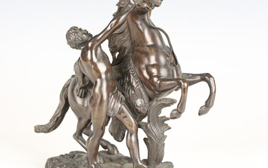 After Guillaume Coustou - a 19th century brown patinated cast bronze model of a Marly horse and atte