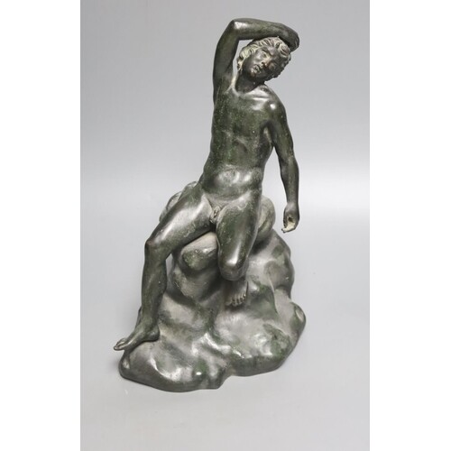 After the Antique a bronze figure of a man seated on a rock,...