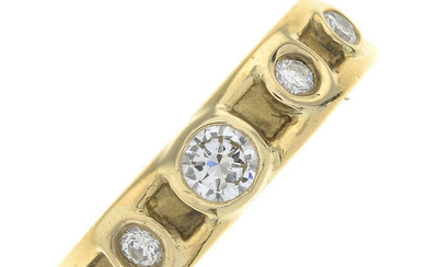 An 18ct gold brilliant-cut diamond band ring.