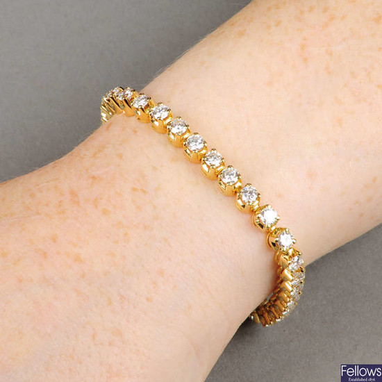 An 18ct gold brilliant-cut diamond line bracelet.
