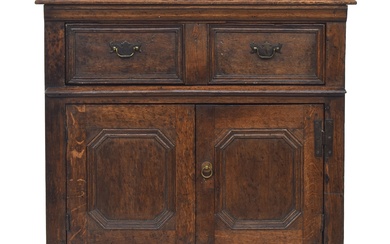 An 18th century and later oak cabinet, having a moulded top ...