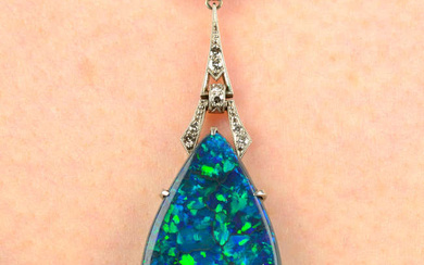 An Art Deco platinum and gold black opal and diamond geometric pendant, on chain.