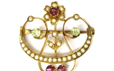 An Edwardian gold tourmaline, peridot and split pearl brooch/pendant