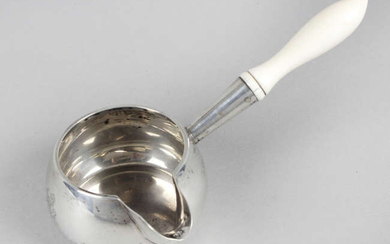 An Edwardian silver brandy warming saucepan, with ivory handle.