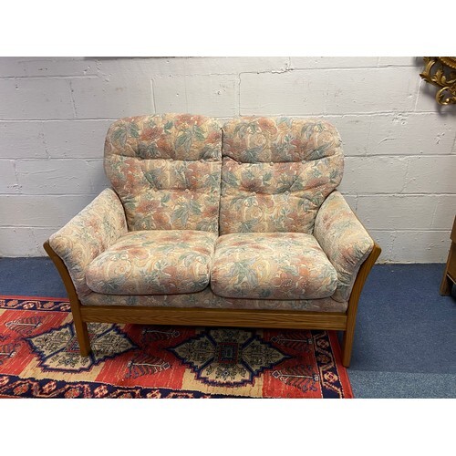 An Ercol two seater sofa/settee and a similar stool