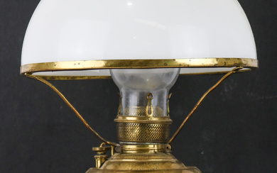An antique Miller (USA) oil lamp in brass with milk...