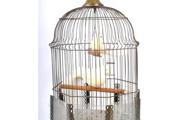 An early 20th Century brass bird cage of octagonal form with...