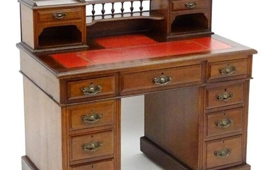 An early 20thC double pedestal mahogany desk with a