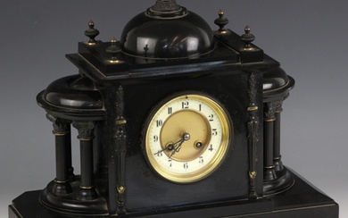 An eight-day polished slate mantel clock, early 20th century...