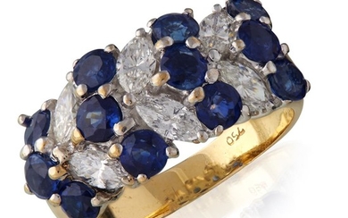 An eighteen karat gold, sapphire, and diamond ring comprised...