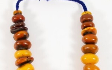 An impressive strand of 23 large Berber resin amber beads...