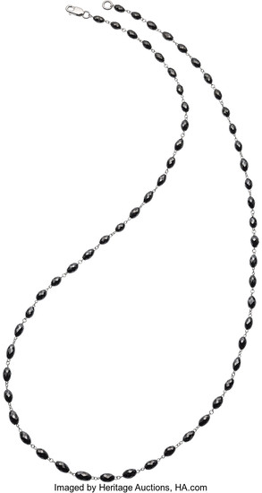 Black Diamond, White Gold Necklace The necklace features...