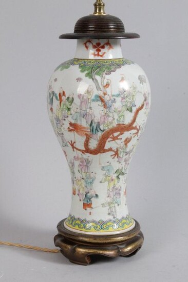 CHINA CANTON: baluster vase mounted in green family porcelain lamp with decoration of a dragon procession. (Fêles) XIX century. H : 30 cm