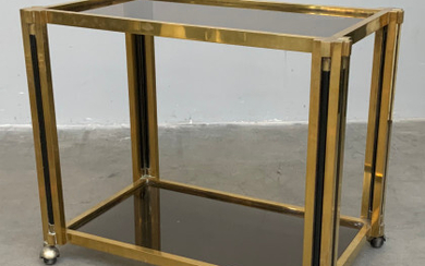 Carrellino con struttura in metallo dorato, piani in vetro fumè. Italia, anni '70. (cm 80x67x50,5) (lievi difetti)