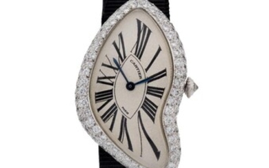 Cartier. A very rare 18ct white gold and diamond set asymmetrical wristwatch, Signed Cartier Paris, Crash model, Numbered A111456, c.1998 silvered asymmetric dial with printed elongated Roman numerals, secret signature at 7, blued steel hands...