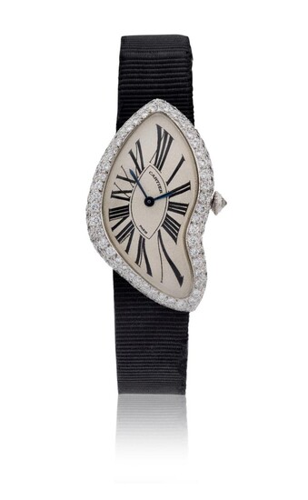 Cartier. A very rare 18ct white gold and diamond set asymmetrical wristwatch, Signed Cartier Paris, Crash model, Numbered A111456, c.1998 silvered asymmetric dial with printed elongated Roman numerals, secret signature at 7, blued steel hands...