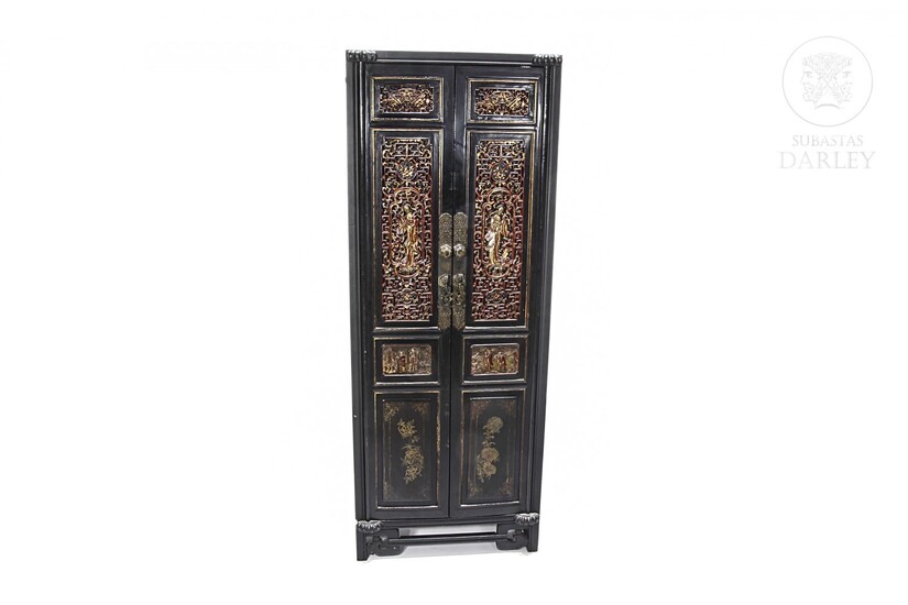 Chinese cupboard with carved and gilded wood panels. early 20th century.