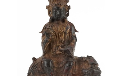 Chino Tibetan gilt bronze figure of Buddha on mythical anima...