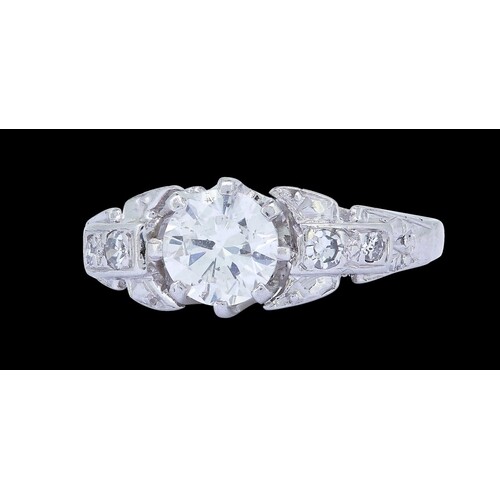 DIAMOND DRESS RING, set with a central diamond of approx. 0....