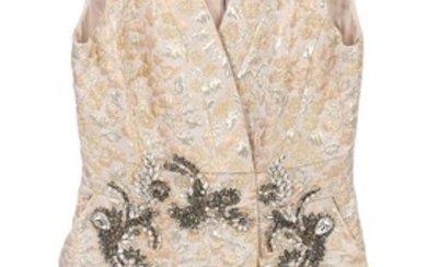 Dolce & Gabbana: A gold dress without sleeves with textured pattern and embellished with grey and white rhinestones. Size 46 (IT)
