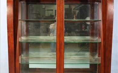 Empire mahogany china cabinet with scroll front