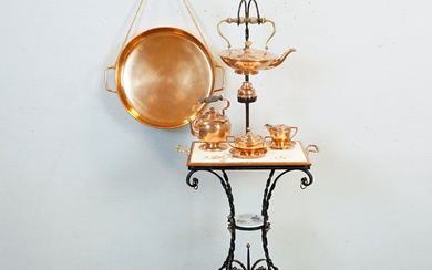 FORGED TABLE WITH TEAPOT AND RECHAUD AND TEA SET IN COPPER.