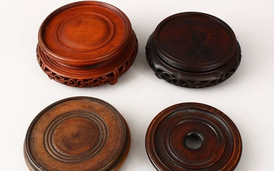 FOUR CHINESE 19TH CENTURY HARDWOOD STANDS, carved and