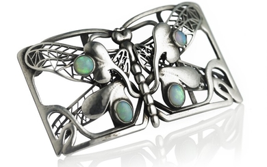 Georg Jensen: An opal brooch/belt buckle in the shape of a dragonfly set with cabochon opals, mounted in silver. Design no. 11. Georg Jensen, circa 1908–14.