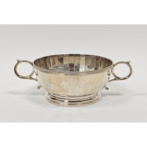 George V silver twin-handled sugar bowl, the reeded rim with...